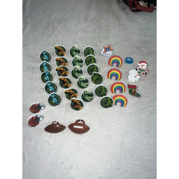 Lot of plastic rings - football, dinosaurs, rainbow, Christmas & whale - Picture 1 of 4